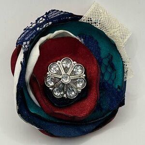 Floral bow hair clip with antique lace and gemstone. Removable feathers